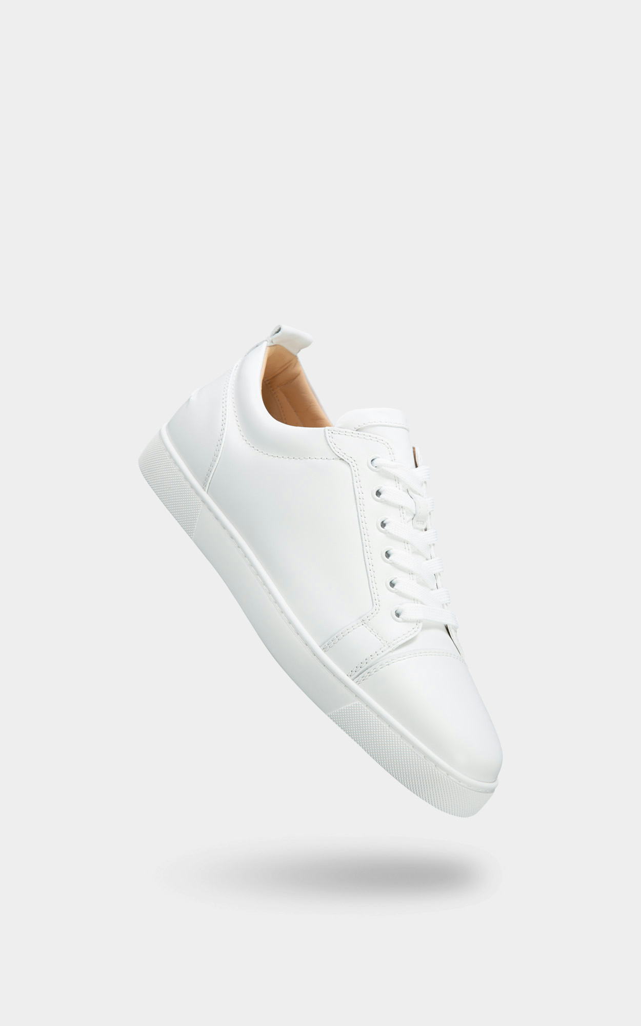 CHRISTIAN LOUBOUTIN - Weiße Low-Top Sneakers aus Leder